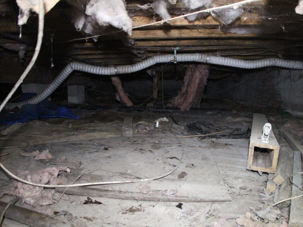 Inside a very dirty crawl space