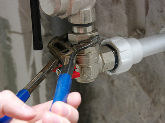 Plumber working on gas pipes